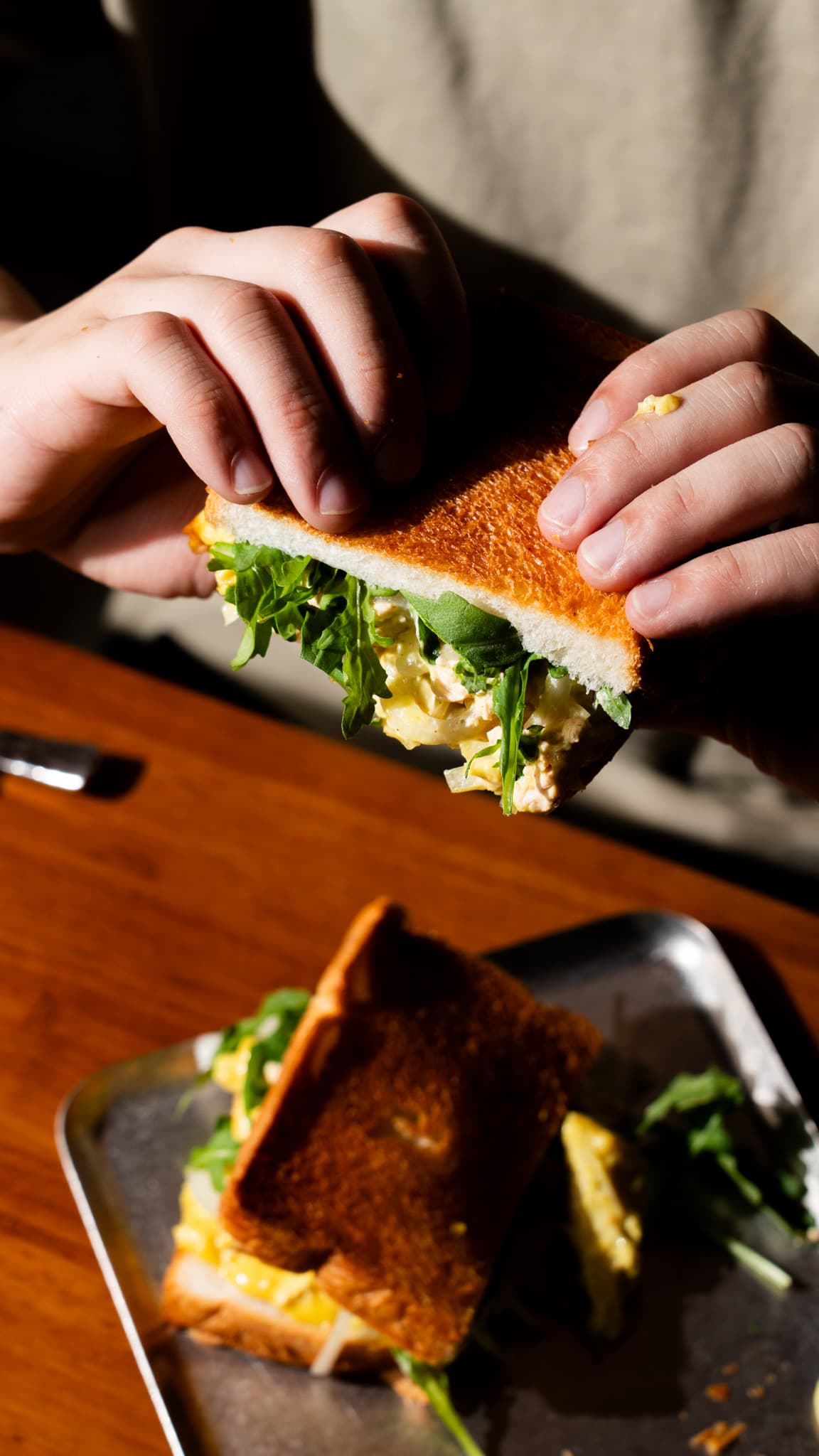 Man eating toast at To;asta.