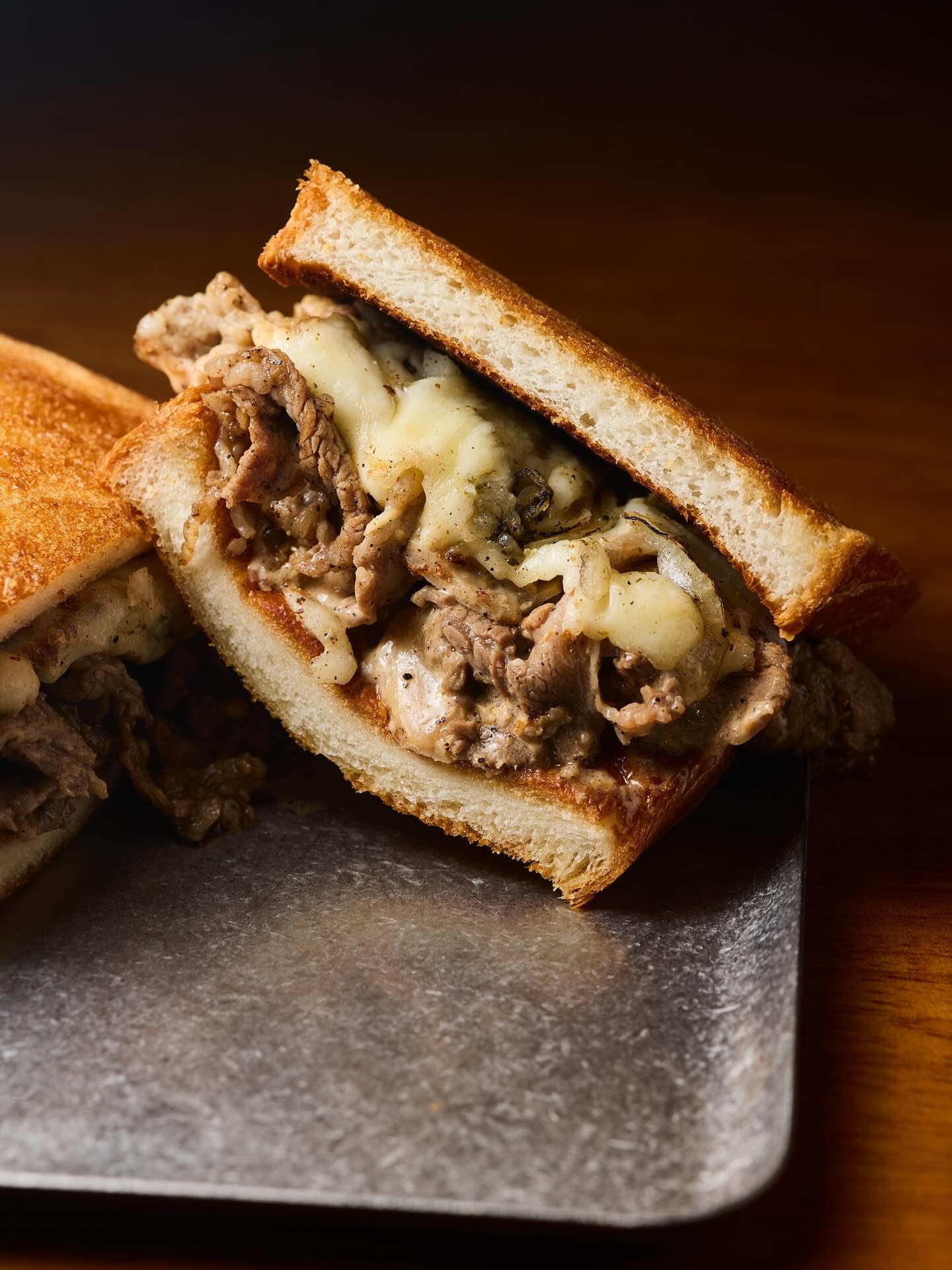 A richly filled toast sandwich at To;asta.